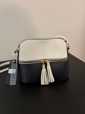 Two-Tone Black and White Crossbody Bag with Tassel Zips
